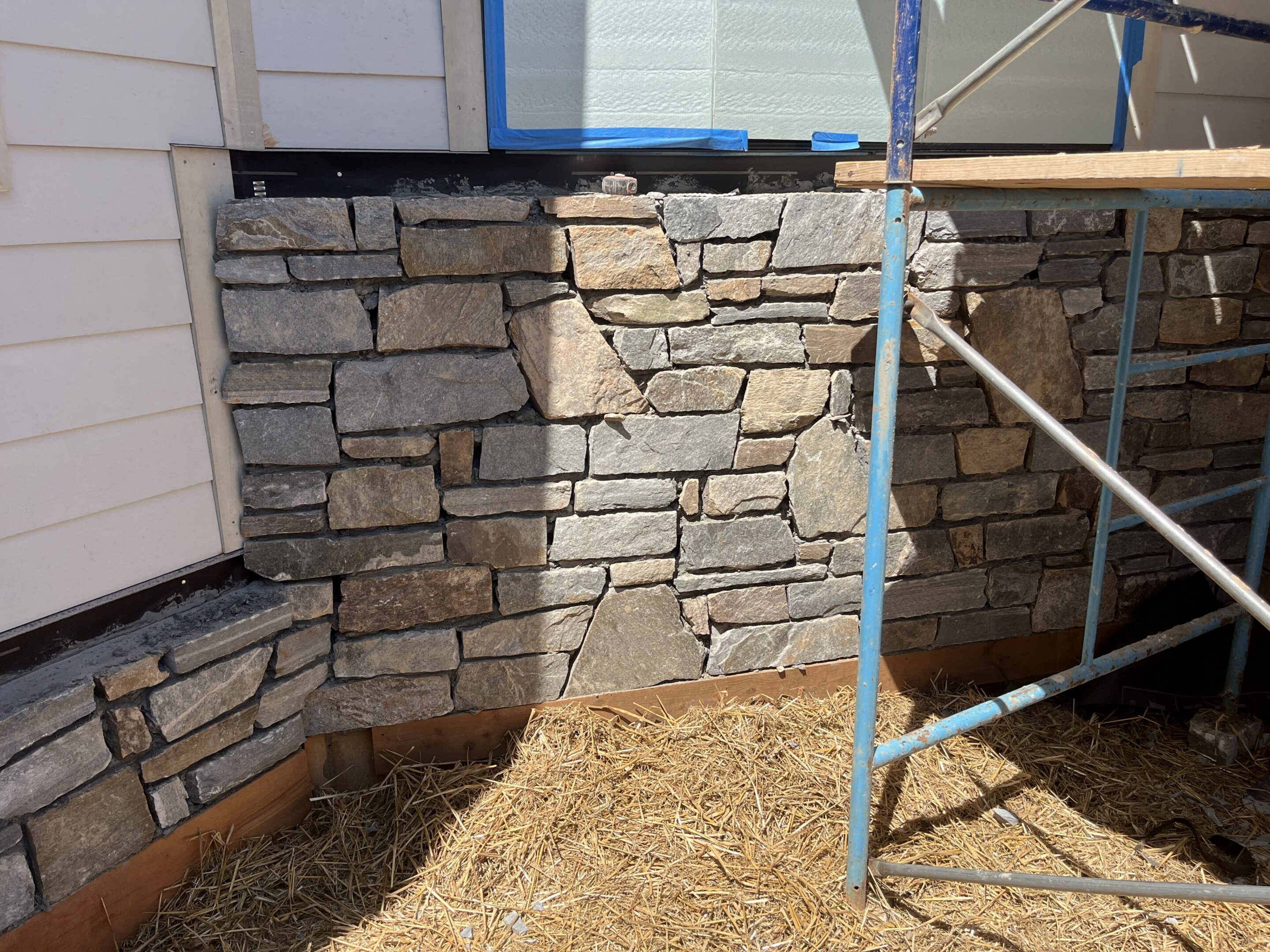 Partially built stone wall exterior