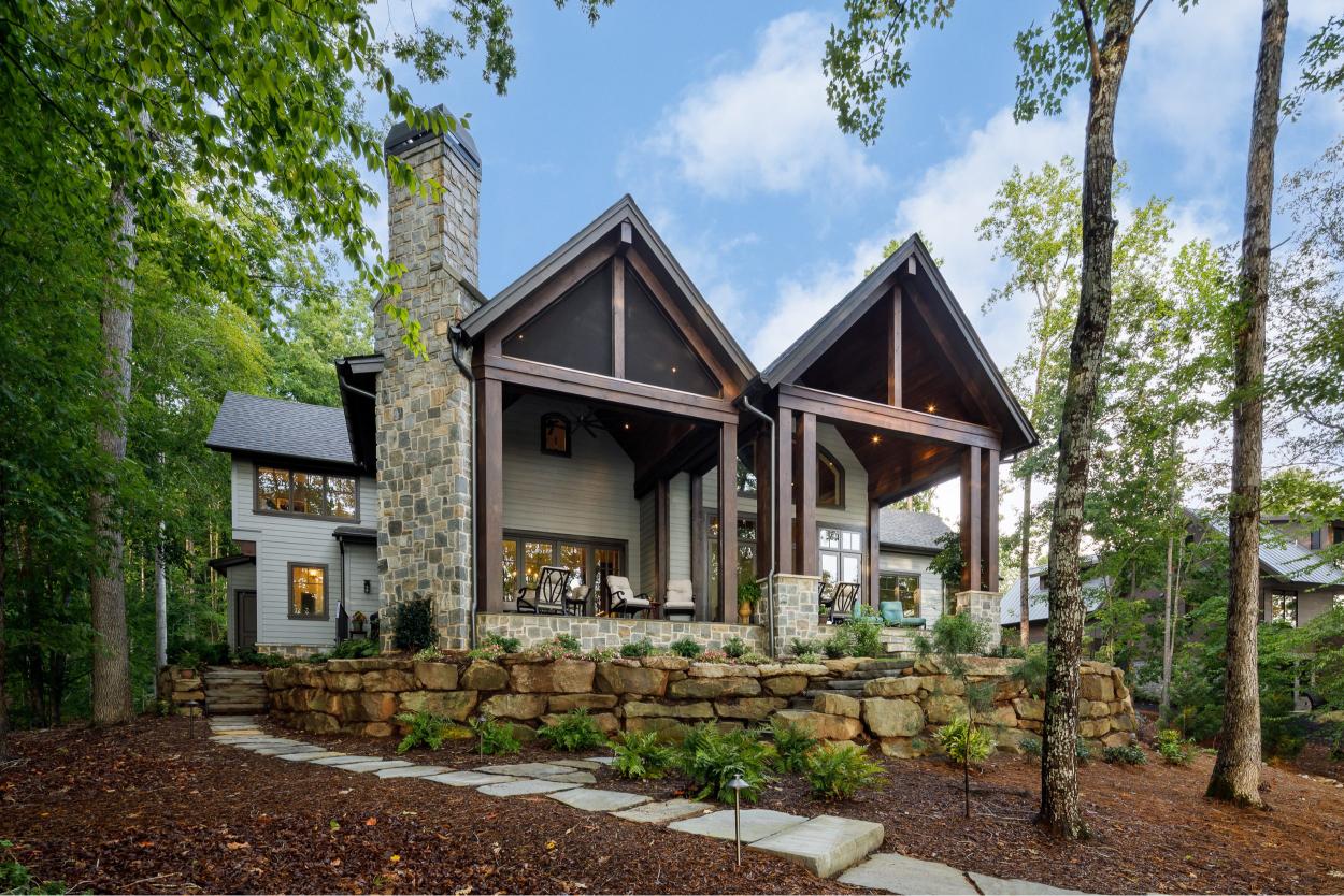 Contemporary home featuring large porch and pillars.