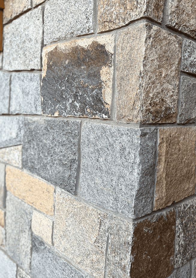Stone wall corner with textured bricks