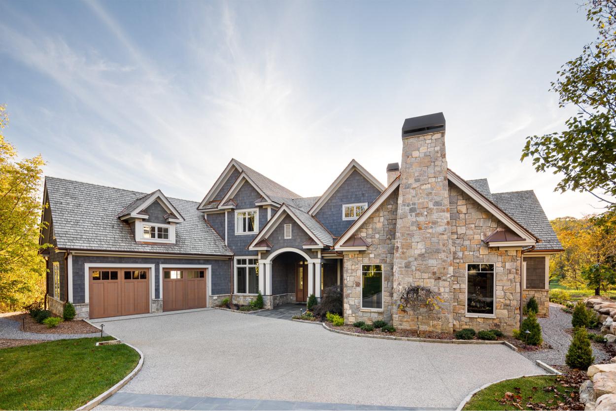 Elegant home exterior with stone chimney